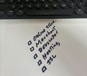 A keyboard, a pen, and a notepad arranged together, symbolizing productivity and planning for the year ahead.