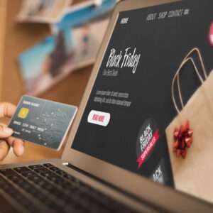 Blog image laptop with online store screen and credit card of a person