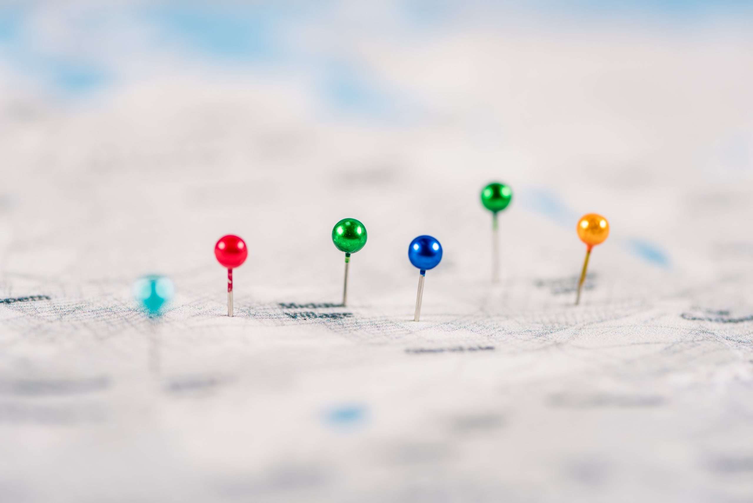 close up shot of colorful pins on map 2024 11 19 14 15 10 utc scaled